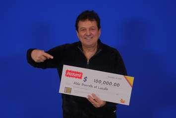 Aldo Borrelli of LaSalle collects his $100,000 cheque at the OLG Prize Centre in Toronto. Photo provided by OLG.