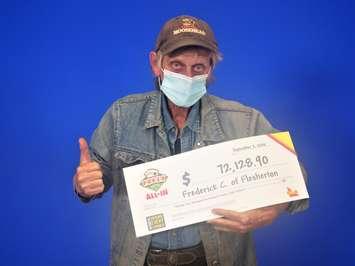 65-year-old Frederick Campbell of Flesherton with his cheque for $72,128.90 after a big win on the OLG Poker Lotto All In. (Photo provided by the OLG)