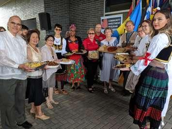 Carrousel volunteers present samples of the food being offered at the 2018 Carrousel of the Nations. (Photo by Alyssa Leonard)