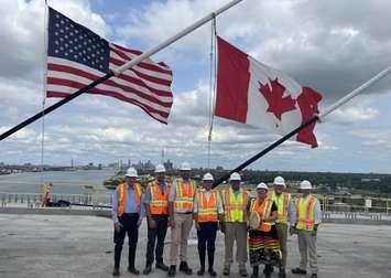 Government officials mark the connection of the Gordie Howe International Bridge deck, July 24, 2024. (Photo by Maureen Revait) 