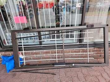 A destroyed door frame is seen outside Bob Reaume Sports in Windsor, November 11, 2024. Photo courtesy Bob Reaume Sports/Facebook.