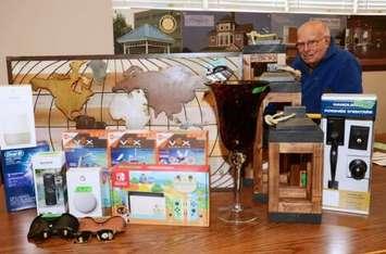 Rotarian Bill Hoad organizes items donated for the club's annual online auction. Submitted photo.