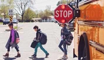 (Photo of children leaving a school bus courtesy of the Canadian Automobile Association)