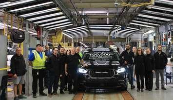 Representatives from Stellantis and Unifor show off the 100,000th Chrysler Pacifica Plug-In Hybrid at the Windsor Assembly Plant, August 31, 2023.