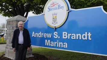 Andy Brandt stands in front of a new sign bearing his name. May 30, 2019 Photo by Melanie Irwin