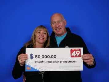 Paul Robinson and Shelley Oglan of Tecumseh show off their Ontario 49 prize cheque at the OLG Prize Centre in Toronto, August 23, 2024. Photo courtesy Ontario Lottery and Gaming.