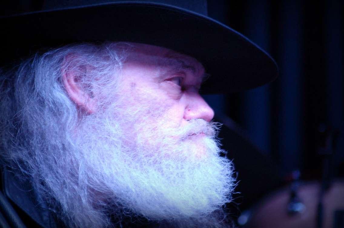 Photo of Garth Hudson. "Garth Hudson - Iridium - 6/23/2012" by 3.26 is licensed under CC BY-SA 2.0. To view a copy of this license, visit https://creativecommons.org/licenses/by-sa/2.0/?ref=openverse.