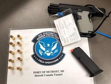 A weapon and ammunition confiscated at the Windsor-Detroit Tunnel on December 9, 2024. Photo courtesy DFO Marty C. Raybon/X.