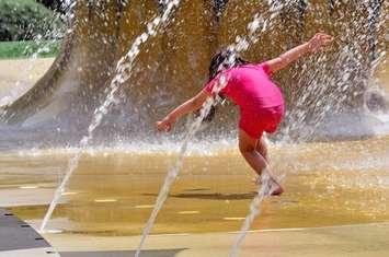 Child playing in spray pad. File photo courtesy of© Can Stock Photo / lucidwaters