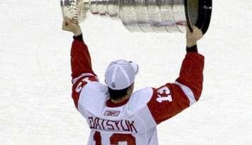 Pavel Datsyuk is seen hoisting the Stanley Cup after the Detroit Red Wings beat the Pittsburgh Penguins in the 2008 Stanley Cup Finals. Photo courtesy Michael Righi/Flickr via Wikipedia.