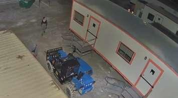 A image taken from a security camera shows two people on a commercial property in Windsor, August 1, 2023. Image courtesy Windsor Police Service/X