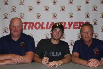 The Petrolia Flyers sign Curtis Helps (middle). Pictured with GM Dennis Meston (left) and Head Coach Ted Archer (right). Photo by Dawn Riley.