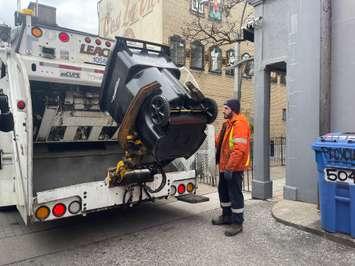 City of Windsor's new lockable garbage bin being collected in downtown Windsor, December 19, 2024. (Photo by Maureen Revait) 