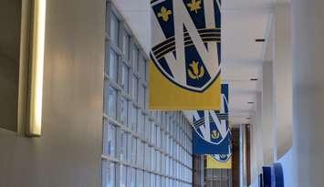 Banners hang at the University of Windsor's CAW Student Centre, February 10, 2025. Photo by Mark Brown/WindsorNewsToday.ca.