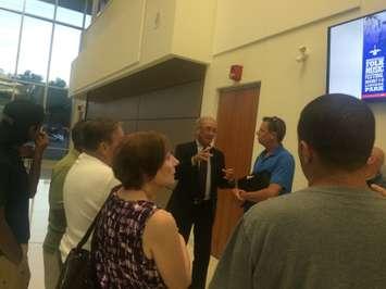 LaSalle Mayor Ken Antaya speaks to residents about a flooding problem after the municipality's regular council meeting on July 28, 2015. (Photo by Ricardo Veneza)