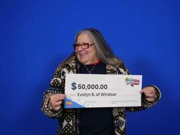 Evelyn Bondy of Windsor shows off her $50,000 cheque at the OLG Prize Centre in Toronto, February 13, 2024. Photo provided by Ontario Lottery and Gaming.