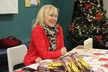 Author and journalist Veronique Perrier Mandal with copies of her book "Getting Off" in Windsor, December 22, 2017. Photo by Mark Brown/Blackburn News.