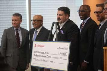 University of Windsor interim president Dr. Douglas Kneale, left, accepts a grant from representatives of Scotiabank at the University of Windsor, February 28, 2019. Photo by  Mark Brown/Blackburn News.