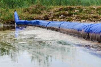 Boom containing oil spill (Photo courtesy of Maxim Trukhin / Royalty-free / iStock / Getty Images Plus)
