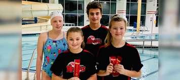 (Top row) Daisy Jenkins and Jack Girardi, (Bottom row) Aili Girardi, Natalie Pretty at the No Pain, No Gain Swim Meet at the University of Guelph. October 2019. (Photo by Sarnia Rapids)