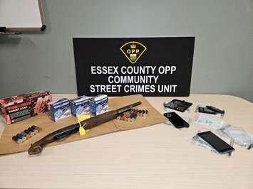 An assortment of weapons and ammunition seized by the OPP in a Leamington raid is shown on November 27, 2024. Photo courtesy Ontario Provincial Police.