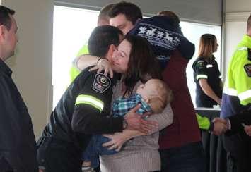 Mom Catherine Marcoux thanks paramedic Rick St-Pierre for helping to save her life and the life of her son Roman on EMS Survivor Day, February 26, 2016. (Photo by Maureen Revait)
