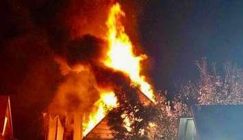 Flames shoot out of a vacant building on Wyandotte Street East near Pierre in Windsor, September 18, 2024. Photo courtesy Unofficial: On Location/X