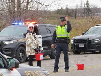 An officer and President of MADD London Sara Neusteter at a West Region OPP led Festive RIDE checkpoint in London, November 7, 2023. (Photo by Miranda Chant, Blackburn Media)