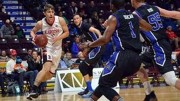 Logan Stutz of the Windsor Express (in white), inbounds the ball against the Kitchener-Waterloo Titans at the WFCU Centre, December 17, 2017. Photo courtesy Ian Shalapata/Windsor Express.