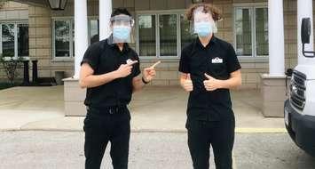 Oscar Allen (right) stands outside Sarnia's Landmark Village with Manager Ankush Sharma (left) who helped him book his COVID-19 vaccination. May 6, 2021 Submitted photo.