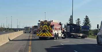Emergency crews on scene of a two-vehicle crash on Highway 401 near Wellington Road, May 7, 2024. Photo provided by Middlesex OPP