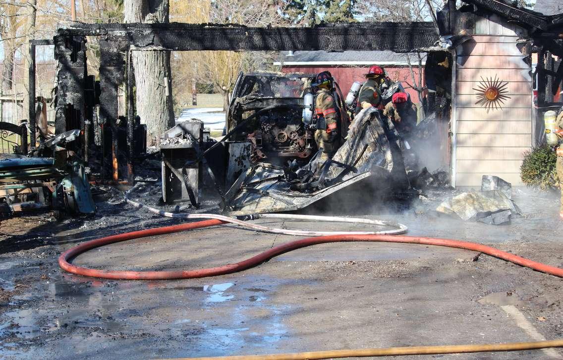 Essex firefighters battle a residential blaze in the 100-block of Park St. in Harrow, March 18, 2015. (Photo by Mike Vlasveld)