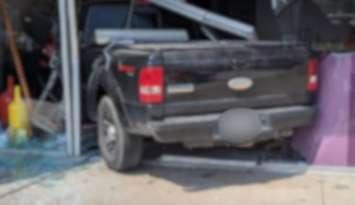 A truck, blurred for privacy, is seen after being driven into a LaSalle business, July 19, 2025. Photo courtesy LaSalle Police/X.