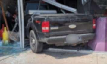A truck, blurred for privacy, is seen after being driven into a LaSalle business, July 19, 2025. Photo courtesy LaSalle Police/X.