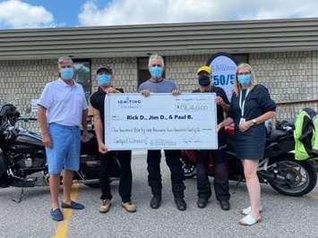 Chatham-Kent Health Alliance Foundation presents James Desjardins, Rick Demarse and Paul Ballay, winners of this year’s Igniting Healthcare 50/50 FUNdraiser, with a cheque for $131, 260  on August 17, 2021. (Photo by Millar Hill)