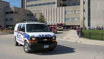 A convoy of London police, fire and EMS vehicles outside of University Hospital showing support to healthcare workers, April 1, 2020. (Photo by Miranda Chant, Blackburn News)