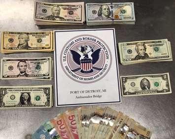 $17,000 in Canadian and U.S. currency that was seized from a traveller is shown on September 30, 2024. Photo courtesy US CBP DFO Marty C. Raybon/X.