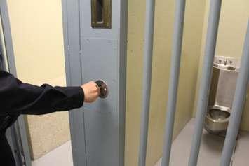 CK Police Department Cell being closed and locked up. (Photo by Greg Higgins)