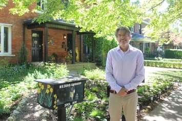 Ward 4 candidate Matt Marchand stands with his community idea box, September 8, 2022. (Photo by Maureen Revait)