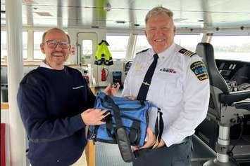 (Photo of Port of Windsor Harbour Master Peter Berry greeting the captain of the M/V Egbert Wagenberg, Francis Bos courtesy of the Port of Windsor)
