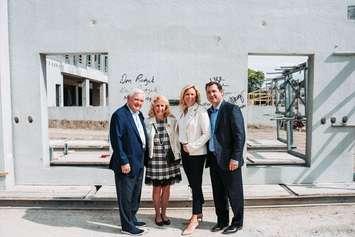 From left, Don Rodzik Sr., Gail Rodzik, Amber Rodzik, and Don Rodzik Jr. pose at the construction site for a new residence at the University of Windsor, May 29, 2024. Photo courtesy University of Windsor.