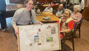 Students connect with seniors at Cardinal Plane in west Windsor, May 27, 2025.(Photo by Maureen Revait) 