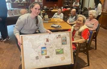 Students connect with seniors at Cardinal Plane in west Windsor, May 27, 2025.(Photo by Maureen Revait) 