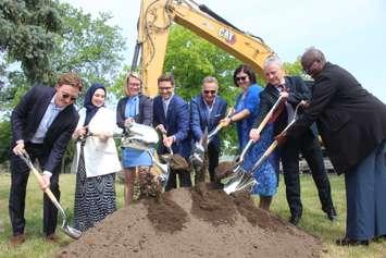 Officials break ground at the construction site of the new student residence at the University of Windsor. 