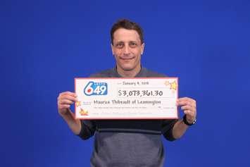Maurice Thibeault picks up cheque. January 5, 2018. (Photo courtesy of OLG)