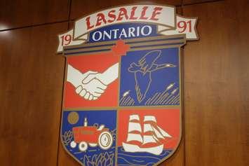 The Town of LaSalle crest hangs above the mayor's chair in Council Chambers at the LaSalle Civic Centre in this photo taken August 26, 2014. (Photo by Ricardo Veneza)