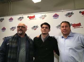 Michael's father Vic (left), Michael DiPietro (centre) & Spits GM Warren Rychel (right). Dec 4, 2018. (Photo by Paul Pedro)