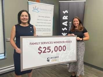 Susanne Tomkins with Caesars Windsor and Ciara Holmes with Family Services Windsor-Essex, July 24, 2024. (Photo by Maureen Revait)