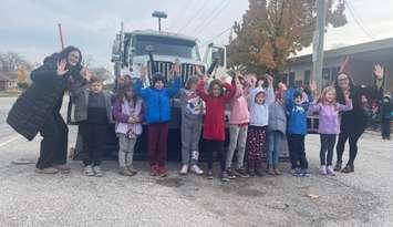 Grade 1/2 class at Sacred Heart Catholic Elementary School with the snowplow, Jack Frost 