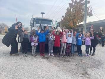 Grade 1/2 class at Sacred Heart Catholic Elementary School with the snowplow, Jack Frost 